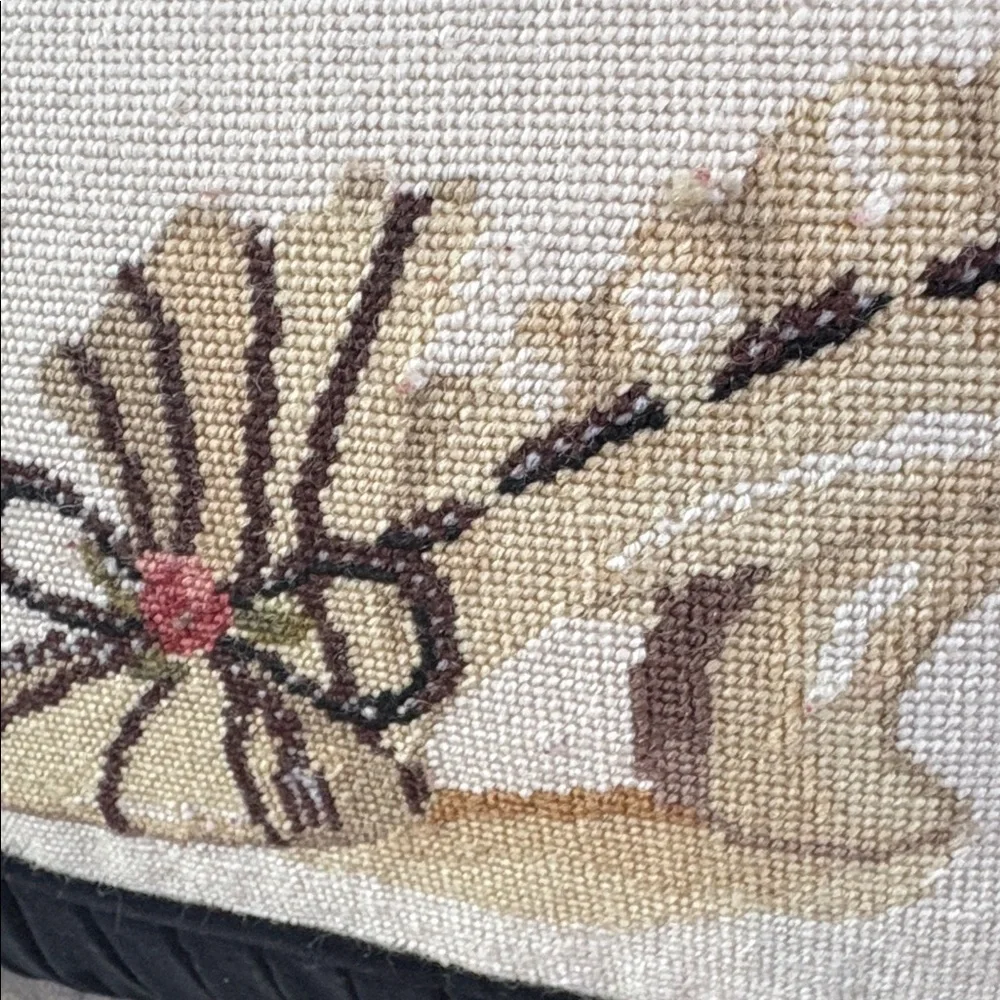 Needlepoint shoe and black velvet pillow with tassels